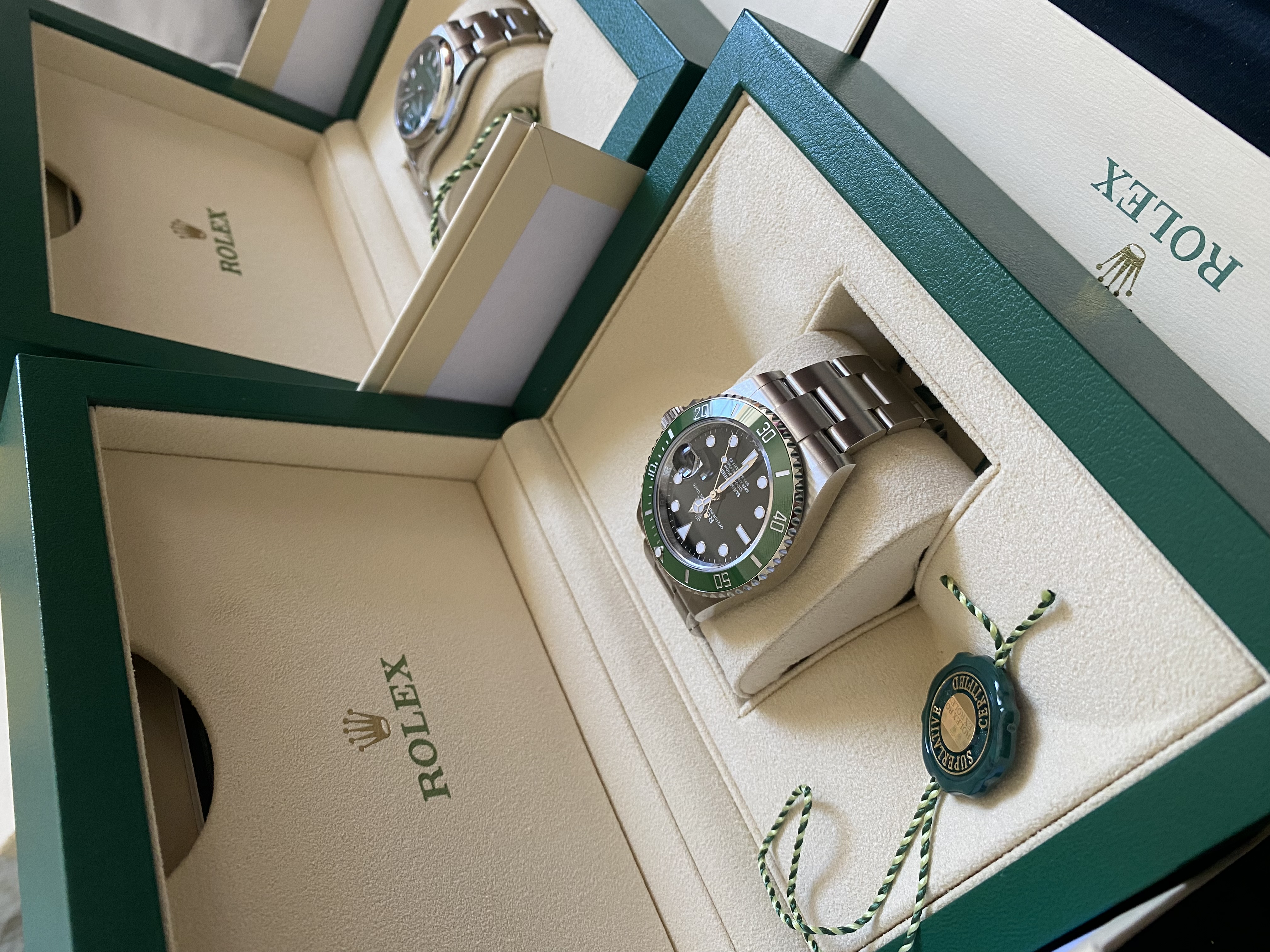Rolex Submariner in box — acquired at retail through boutique positioning